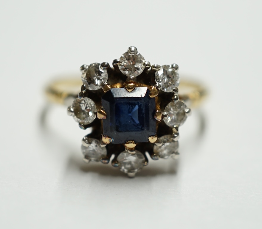 An 18ct gold, sapphire and diamond set flower head cluster ring, size O, gross weight 3.8 grams. Condition - fair